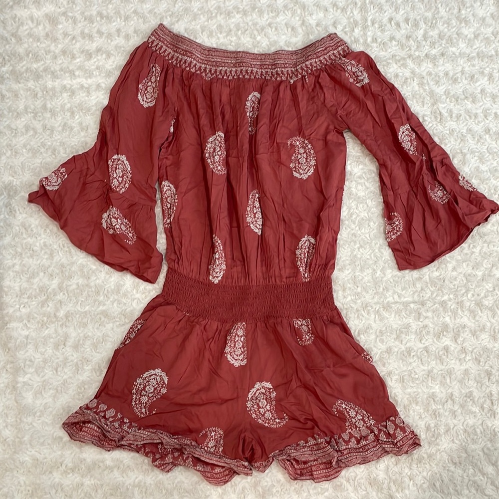 Size S Romper. Pink and white. Never worn.